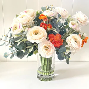 A picture of mix flowers: Peonies, Eucalyptus and Ranunculus.