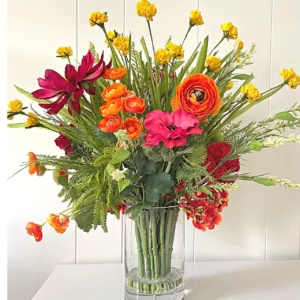 A picture of a floral arrangement with different types of flowers such as roses, peonies, etc.